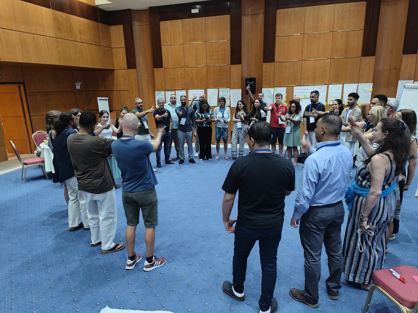 Participants standing together during the partner matching session