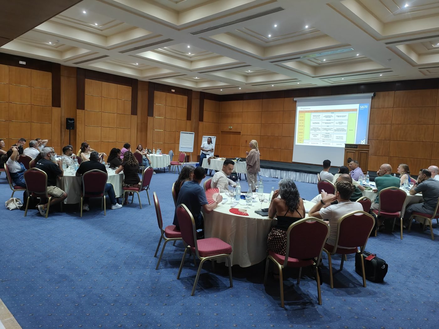 Plenary session with all organisations seated at round tables