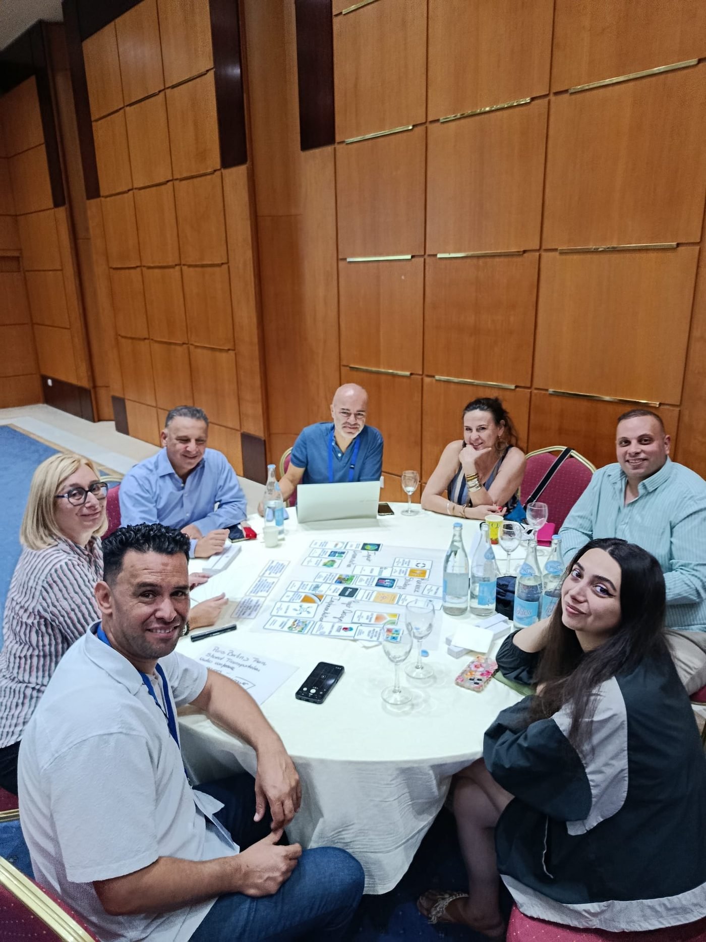 A small working group around a table designing a project together